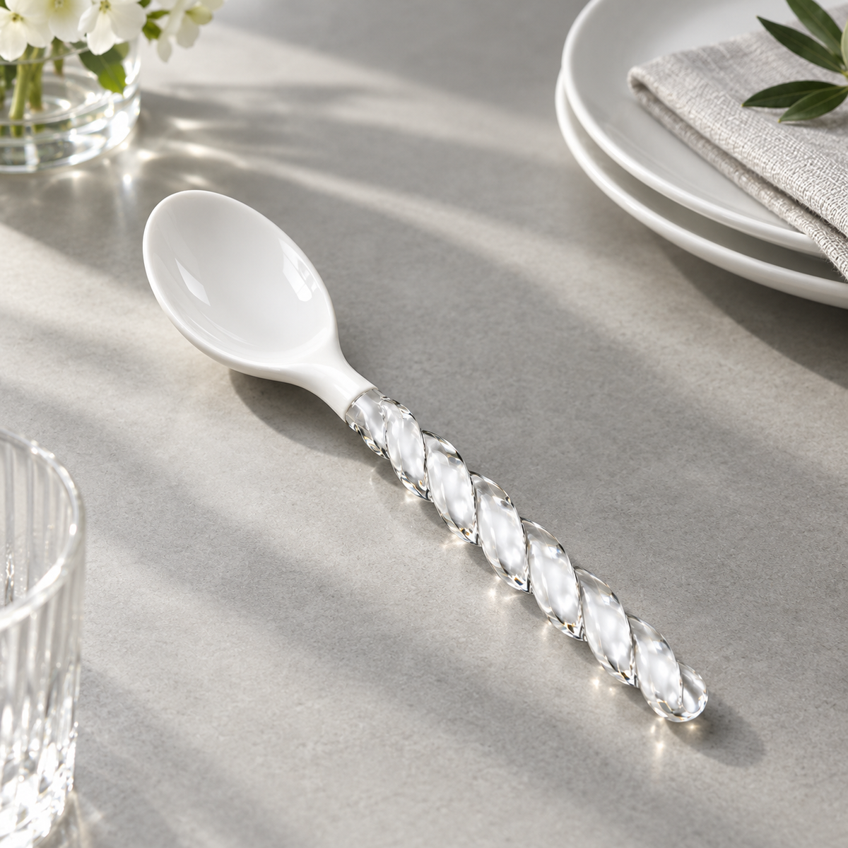 Side view of ceramic spoon with glass handle
