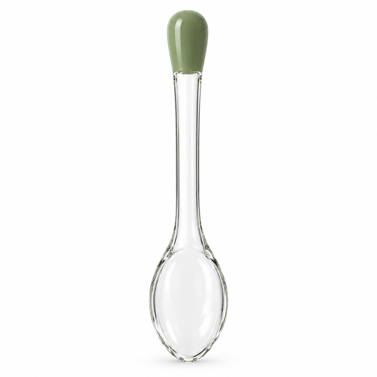 Side view of glass spoon with green handle