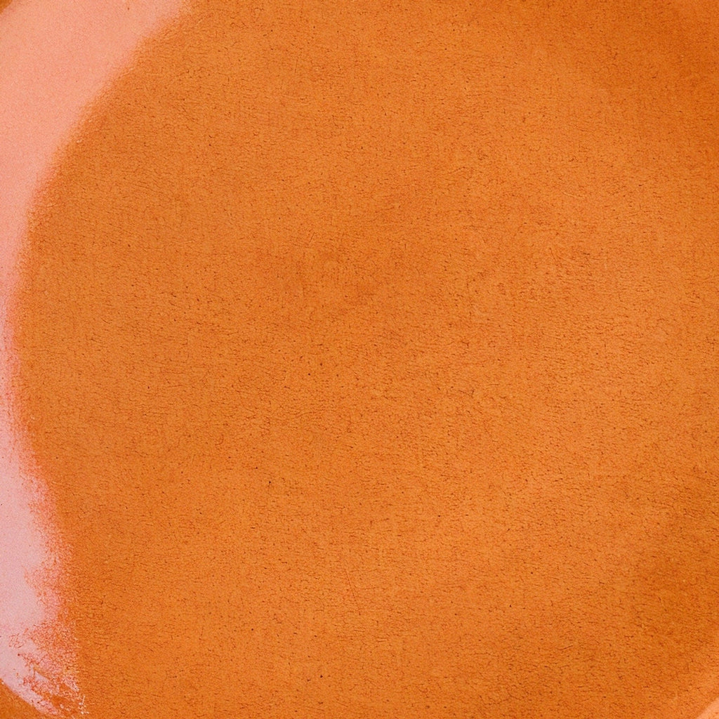 Remoxila Sunset Orange Plate — macro detail of the central glaze texture