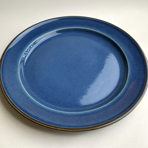 Remoxila Cobalt Blue Plate — three-quarter angled view showing full top face and rim