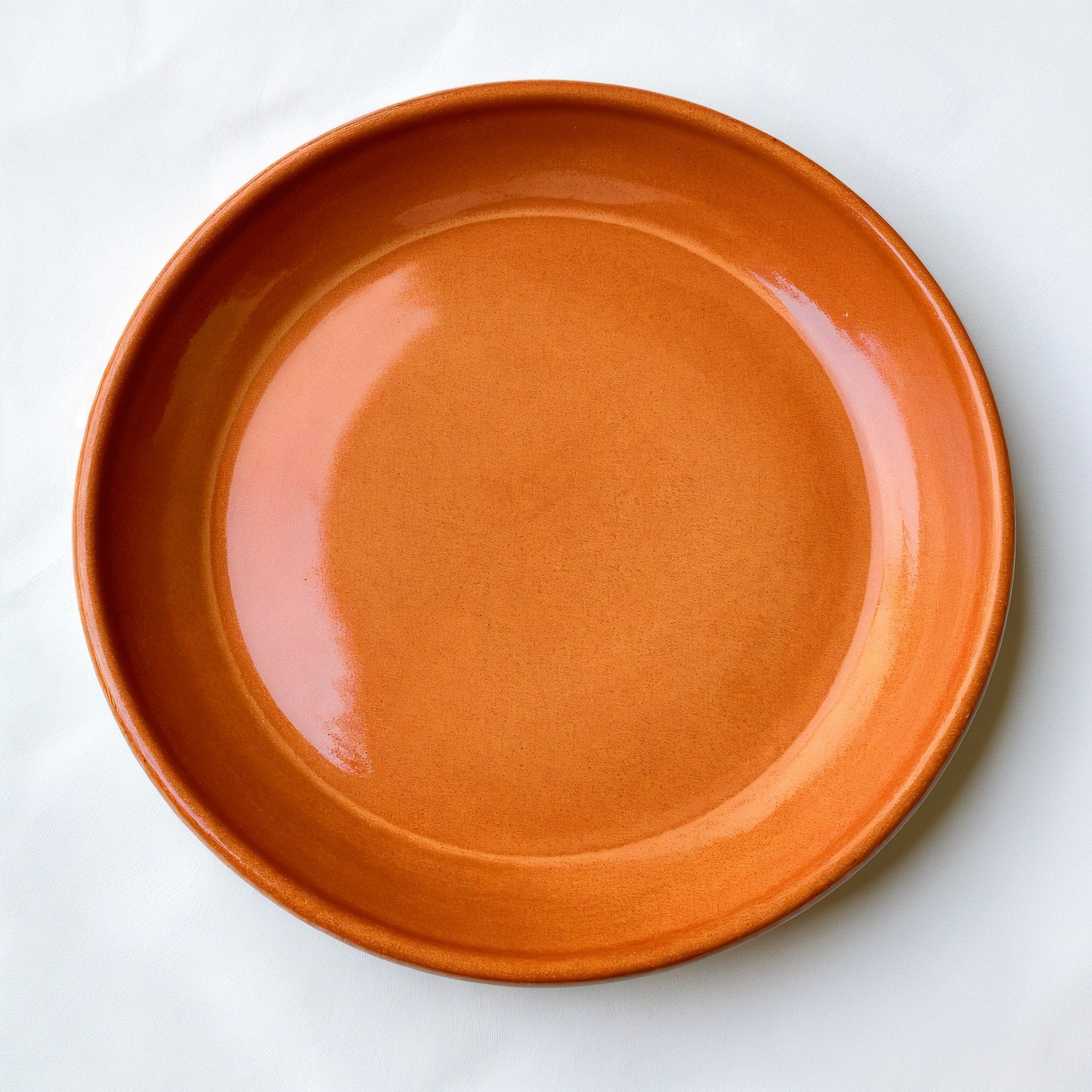 Remoxila Sunset Orange Plate — top-down view displaying entire plate face