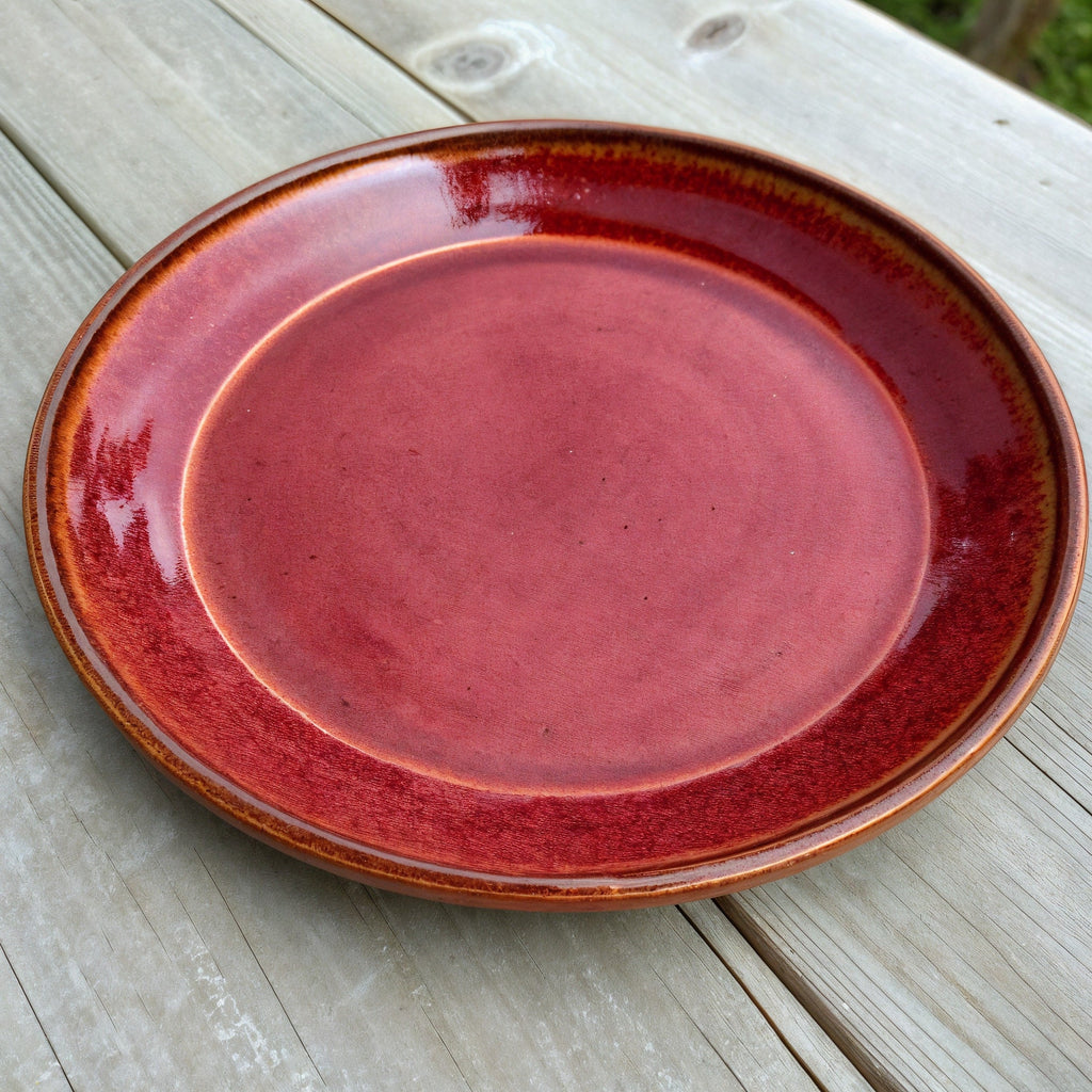 Remoxila Crimson Red Plate — three-quarter angled view showing full top face and glaze