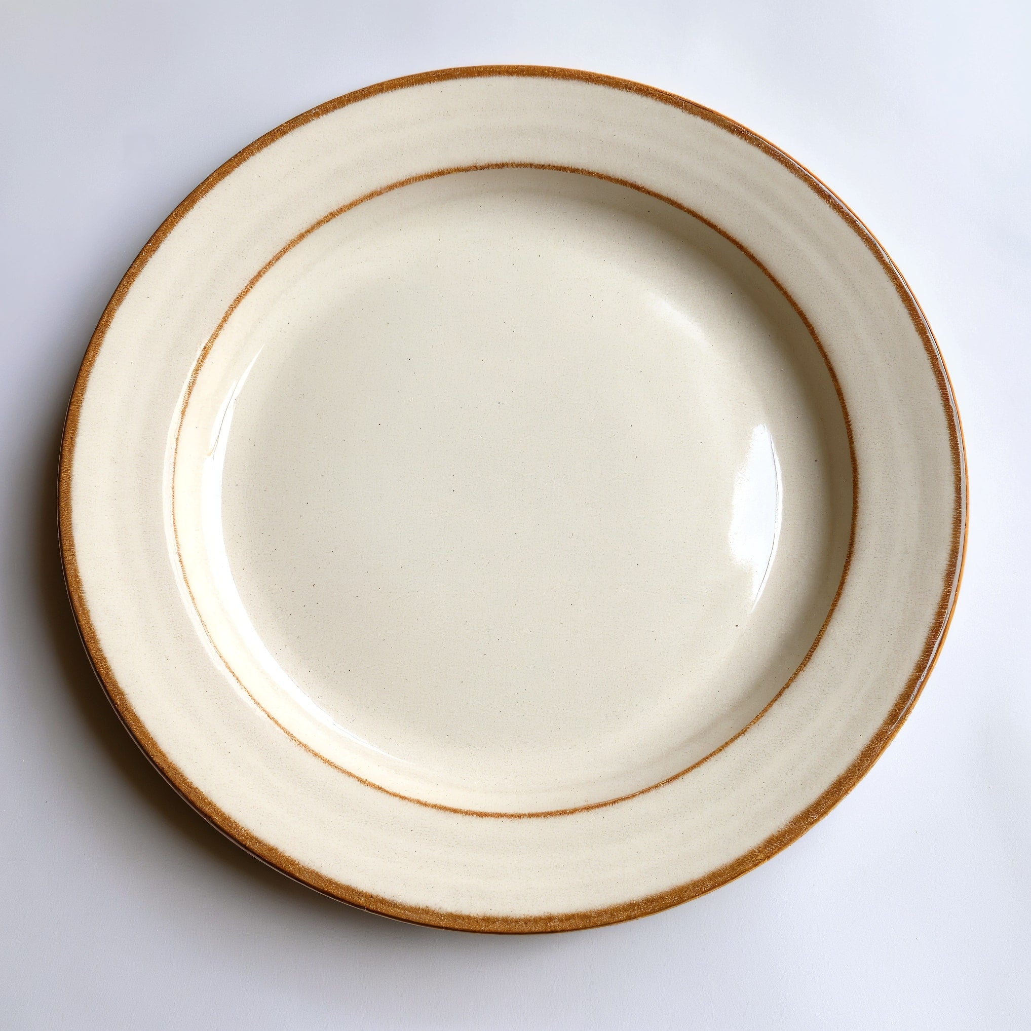 Remoxila Pearl White Plate — strict top-down view showing full round face and glaze
