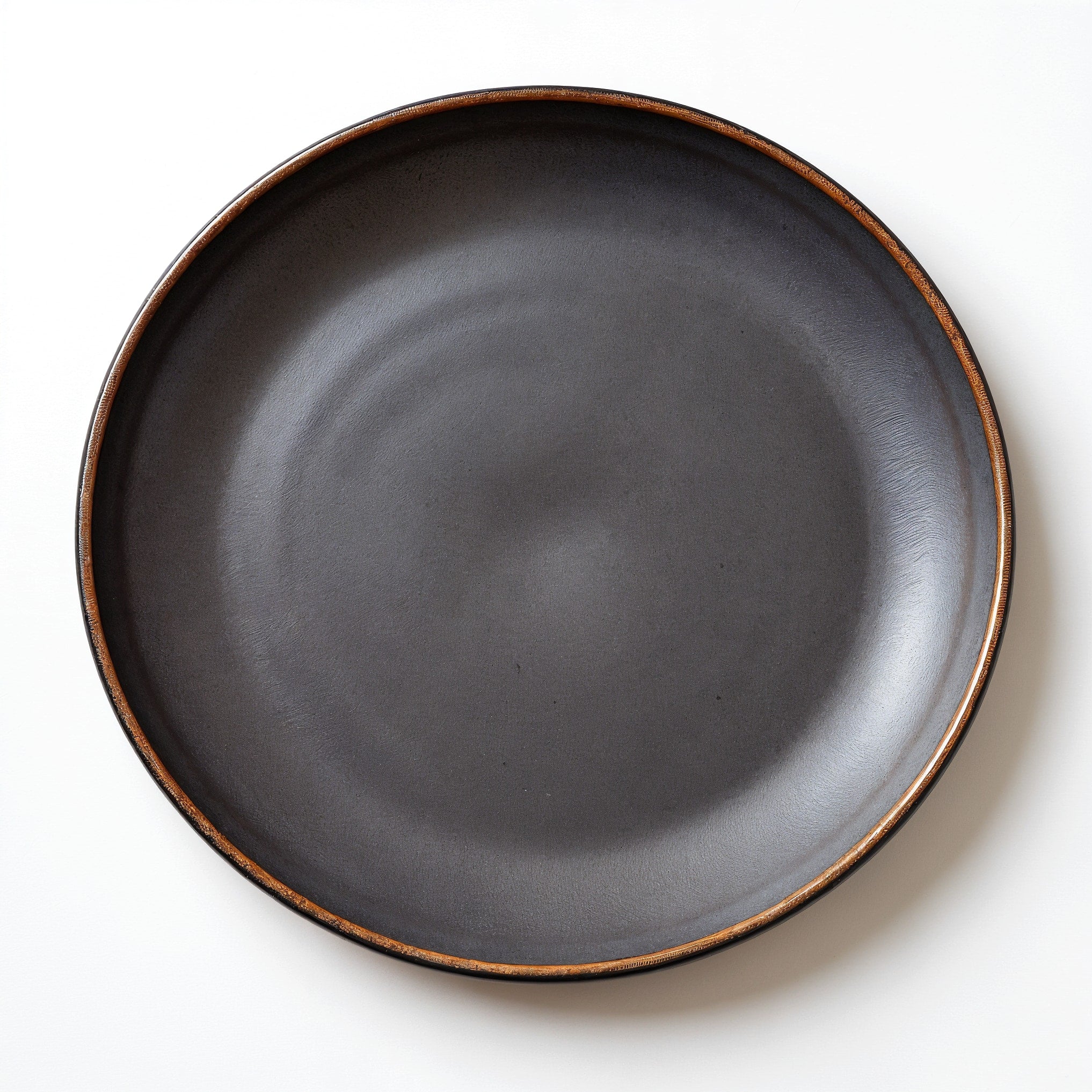 Remoxila Charcoal Black Stoneware Plate — top-down view showing the plate as a perfect circle