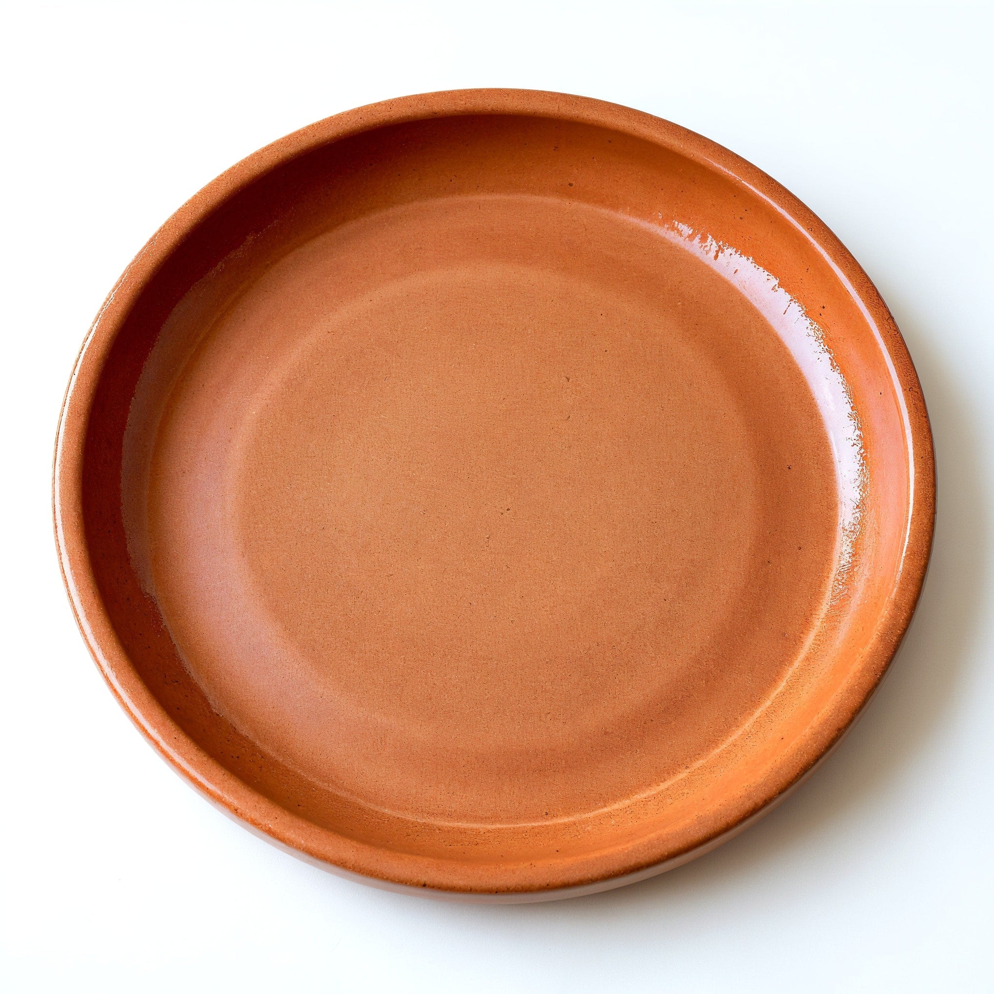 Remoxila Rustic Terracotta Plate — top-down view showing full round face and glaze