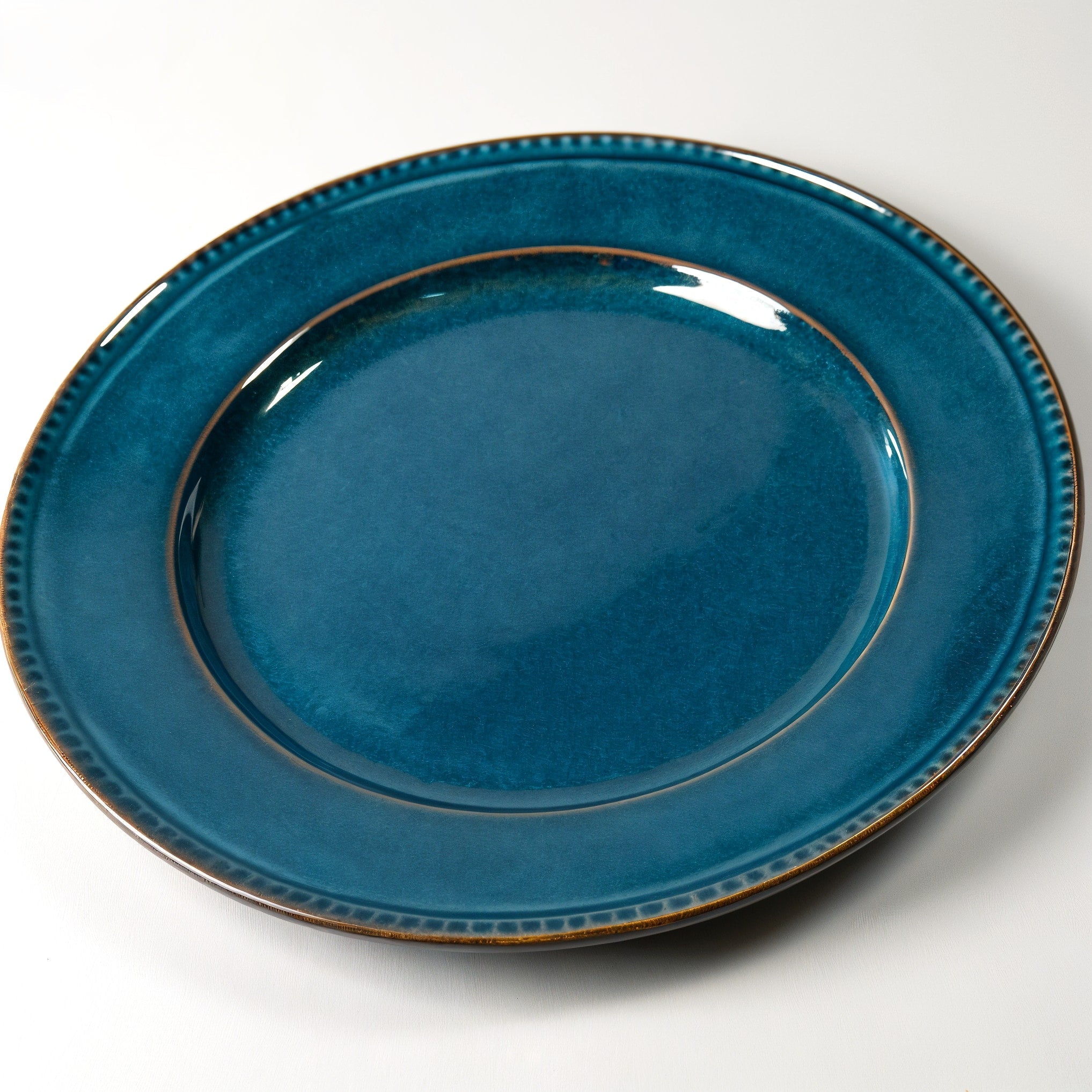 Remoxila Deep Ocean Plate — three-quarter angled view showing full plate and glaze