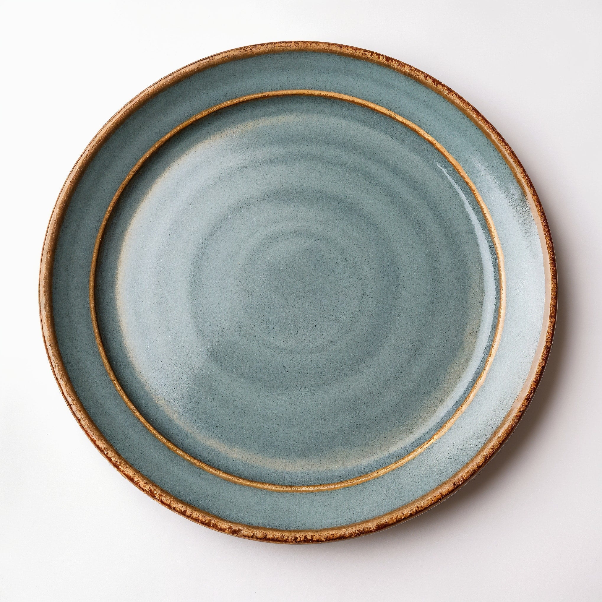 Remoxila Cool Grey Plate — strict top-down view showing circular top face