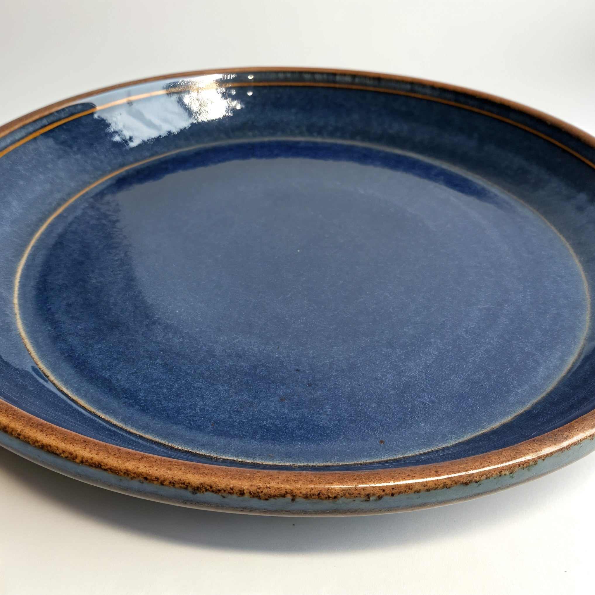 Remoxila Midnight Blue Plate — hero front view showing full top face and glaze