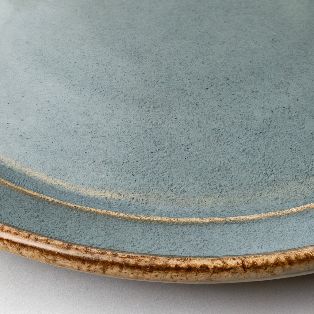 Remoxila Cool Grey Plate — macro rim detail showing raised edge and glaze pooling